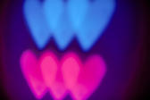 Blurred heart background of overlapping pink and blue depciting love and romance between girls and boys